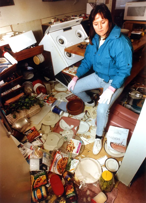 Theresa Wright tries to make order out of the chaos in the kitchen of her Granada Hills home following the Jan. 17, 1994 Northridge quake. (Photo by Tina Burch, Los Angeles Daily News/SCNG)